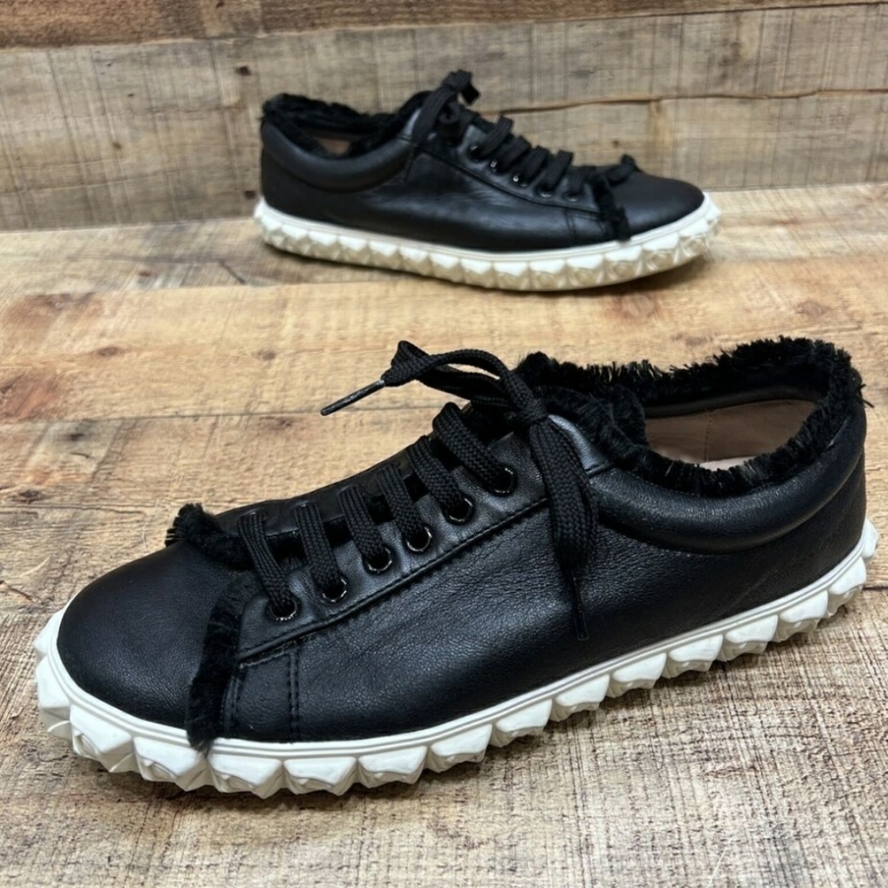 Stuart Weitzman Coverstory black leather sneakers with sculpted rosebud soles